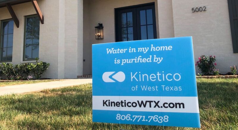 house with kinetico signage out front