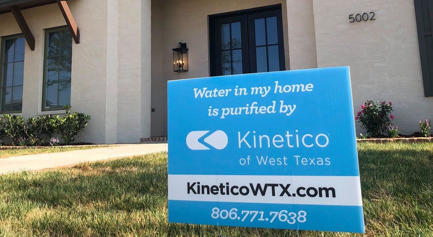 house with kinetico signage out front
